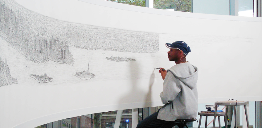 Figure: Stephen Wiltshire drawing a detailed rendering of New York City from memory, following a 20-minute helicopter ride